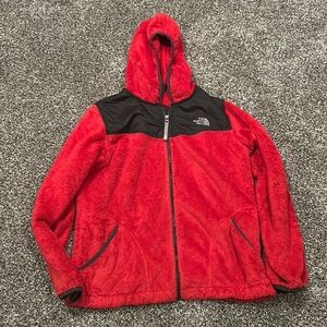 Red fuzzy North Face jacket